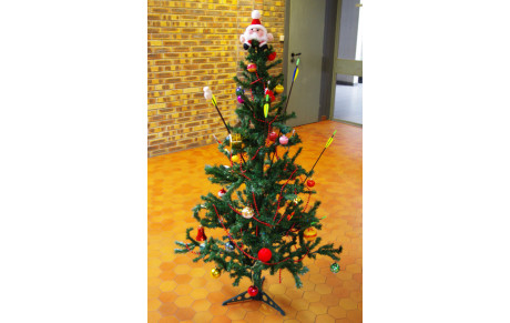 Le Père Noël fait du tir à l'arc !